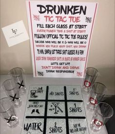 a tic - tac - toe game is set up on a table with glasses