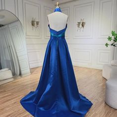 a blue dress is on display in a room