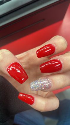 Red nails with one silver nail. Perfect for the holidays. Red Silver White Nails, Nails That Look Good With Red Dress, Red Nails One Glitter, Toe Nail Colors For Christmas, Christmas Nail Designs Red And Silver, Simple Acrylic Nails Christmas, Simple Christmas Nails Solid Color, Red Nails Silver Glitter, Homecoming Red Nails