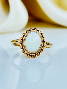 Sweet Vintage 9ct Gold Opal Ring Beautiful Opal ring  The item comes without the box in the photo but will be presented in a Gembank1973 gift box Measurements: weight 1.87g, size UK M US 61/2, head of ring 12mm x 10mm, height off finger 5mm Materials: 9ct gold and Opal    Hallmarks: hallmarked 375 Condition: The overall condition is very good Office use: UZZ Classic Gold Opal Ring As Gift, Classic Gold Opal Ring For Gift, Victorian Gold Opal Ring Gift, Yellow Gold Opal Ring Hallmarked As Gift, Yellow Gold Hallmarked Opal Ring For Gift, Yellow Gold Hallmarked Opal Ring As A Gift, Classic Opal Birthstone Ring As Gift, Classic Opal Birthstone Ring, Heirloom Yellow Gold Opal Ring As A Gift