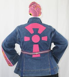 Handcrafted One-Of-A-Kind Introducing our Diasporic denim Jacket, a fusion of Afro-inspired fashion and cultural couture designed to celebrate Black heritage and African influence in contemporary attire. Crafted with meticulous detail, this jacket boasts a genuine leather applique of a stylized Ankh. The Ankh is an ancient Egyptian symbol of life and eternal existence. While the beauty of the Ankara fabric pays homage to Pan-African fashion, when combined with metal zippers, grosgrain ribbon tri Leather Applique, The Ankh, Ancient Egyptian Symbols, Black Heritage, Pan African, Egyptian Symbols, American Denim, Upcycle Jeans, Life Symbol