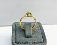 Natural Peridot Ring * Dainty Cabachon Ring * Genuine Peridot & 14K Solid Gold * Best Gift for Her/Him * Handmade Ring ◎ Details ◎ ○ Gemstone Details .Natural PERIDOT Oval Cut 9X7 mm approx. 2.01 ct ○ Gold Details 14K Solid Gold Width of Band : 2.50 mm Weight of Ring : approx 3.80 gr Made to Order HANDMADE ITEM ○ Upgrade to Solid 18K Gold, please click the link below: https://www.etsy.com/listing/962826004 For more CABACHON BEZEL rings : http://etsy.me/37fvI60 ○ PERIDOT RINGS : https://etsy. 14k Gold Rings With Cabochon Round Stone, Yellow Gold Cabochon Ring, Gold Oval Cabochon Birthstone Ring With Bezel Setting, Gold Emerald Ring With Round Stone, Yellow Gold Oval Cabochon Rings With Birthstone, Round Gemstones With Bezel Setting In 14k Gold, 14k Gold Gemstones With Bezel Setting, 14k Gold Round Gemstones With Bezel Setting, Gold Peridot Birthstone Ring