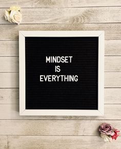 a black and white framed sign with the words mindset is everything written on it