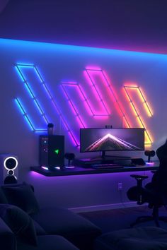 A game room with neon lighting from Nanoleaf Lines Hexagon Led Gaming Room Ideas, Led Light Setup, Guys Gaming Room, Boys Room Led Lights, Gaming Led Lights, Gaming Room Lighting, Gaming Room Background, Neon Gaming Room, Hexagon Led Light