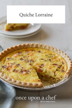 a quiche on a table with the words, once upon a chef written below it