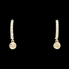 A pair of 14k yellow gold and diamond huggie earrings with a single bezel set diamond drop. SE1154 Weight: 1.00 grams (Inclusive of all materials) Diamonds (8) Round Cut Color: G - H Clarity: SI1 - SI2 Stone Measurements: 0.85 - 2.00 mm - approximate Carat Weight: 0.15 ctw Opal Diamond Ring, Diamond Huggie Earrings, Diamond Huggies, Gold Cushions, Opal Ring Gold, Bezel Set Diamond, Cabochon Ring, Halo Diamond Ring, Huggie Earrings