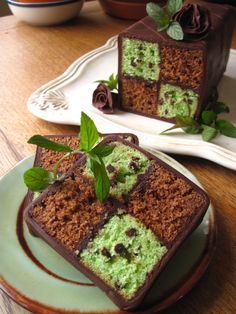 two slices of chocolate cake with green frosting