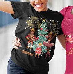 A harmonious blend of cultural richness and classical elegance that celebrates the diversity of the Nutcracker tradition! Step into the enchanting world of dance and magic with this uniquely crafted shirt that pays homage to the beauty and grace of African American performers in the timeless Nutcracker ballet. This classic unisex jersey short sleeve tee fits like a well-loved favorite. Soft cotton and quality print make users fall in love with it over and over again. These t-shirts have-ribbed k Black Short Sleeve T-shirt For Festive Occasions, Black Nutcracker, Gifts For Dancers, Nut Cracker, Black Ballerina, Nutcracker Ballet, Black Christmas, Christmas T Shirt, Christmas Tshirts