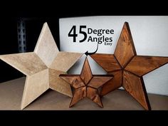 three wooden stars sitting on top of a table next to a sign that says 45 degree angles