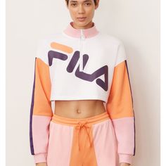 This One-Of-A-Kind Sweatshirt Features A Bold, Feminine Look Thanks To The Cropped Cut And Multicolor Block. A Half-Zip And Oversized Fila Logo Make It Stand Out Even More. Brushed Back Fleece: 80% Cotton/ 20% Polyester Mesh: 100% Polyester Fila Printed Chest Logo Half Zip Front Rib Funnel Neck With Ring Puller Mesh Inserts On Sleeves Rib Cuffs. White Cropped Relaxed Fit Sweatshirt, White Fitted Sweatshirt For Spring, Fitted White Sweatshirt For Spring, Spring White Fitted Sweatshirt, Trendy Fitted White Sweatshirt, White Cropped Cotton Sweatshirt, White Fitted Sweatshirt For Loungewear, Fitted White Sweatshirt For Loungewear, White Athleisure Tops For Fall