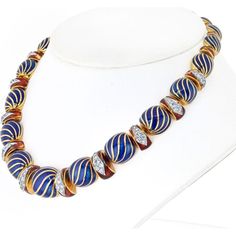 Revel in the fusion of heritage and modernity in this Exquisite Blue Enamel Necklace by David Webb. Crafted with meticulous attention to detail, this necklace is a testament to timeless elegance and sophistication. The striking blue enamel adds a touch of vibrant color, creating a captivating contrast against the luxurious platinum and 18K yellow gold setting. The graduated width, ranging from 10mm to 15mm, enhances the necklace's visual appeal, making it a statement piece that commands attention.Designed for those who appreciate fine craftsmanship and unique design, this necklace is a true masterpiece. The hidden lock with safety ensures both security and comfort, allowing you to wear it with confidence. Whether worn for a special occasion or as an everyday luxury, this necklace exudes ch Elegant Round Enamel Necklaces, Elegant Blue Enamel Jewelry, Traditional Enamel Necklaces For Formal Occasions, Formal Enamel Necklace, Traditional Blue Necklaces For Formal Occasions, Traditional Blue Enamel Necklaces, Hidden Lock, David Webb, Everyday Luxury