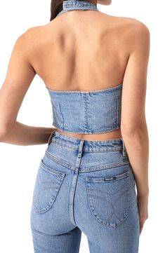 This faded denim top is crafted in a cropped silhouette and designed with a sleek halter neck. 18 1/2" center front length; 16 1/2" center back length (size Medium) Halter neck 99% organic cotton, 1% elastane Machine wash, line dry Imported High Waist Denim Crop Top In Medium Wash, Fitted Dark Wash Tube Top For Summer, Fitted Medium Wash Crop Top For Summer, Fitted Cropped Denim Top For Summer, Chic Fitted Light Wash Denim Top, Washed Blue Cropped Tops For Spring, Fitted Denim Tube Top For Spring, Fitted Denim Blue Top, Chic Medium Wash Crop Top For Summer