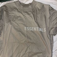 New Never Worn Essentials T-Shirt Sand Color Oversized Essential Summer Crew Neck Top, Essential Cotton Top With Letter Print, Essential Relaxed Fit Tops For Streetwear, Relaxed Fit Essential Tops For Streetwear, Essential Graphic Print Tops For Streetwear, Essential Short Sleeve Summer Tops, Trendy Drop Shoulder Tops With Logo Print, Trendy Drop Shoulder Top With Logo Print, Casual Everyday Shirt With Logo Print