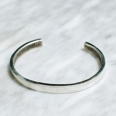 Minimalist 925 Sterling Silver cuff bracelet for men or women. A minimalistic silver cuff bracelet style adds the perfect touch dressed up or down. Available in Brass https://etsy.me/2FJXUS5 Bracelet Size Medium (Women's) Large (Men's) Every piece is handcrafted in Bali and made with Intention, Love, and Soul so that it can be felt by it's wearer and ultimately change our energy and lives in a positive way. Each with it's own story of insight and love, our pieces, like humans, are organic and as Silver Open Cuff Bracelet For Everyday, Everyday Silver Open Cuff Bracelet, Minimalist Sterling Silver Cuff Bracelet Gift, Minimalist Open Cuff Bangle For Everyday, Adjustable Classic Sterling Silver Cuff Bracelet, Classic Adjustable Sterling Silver Cuff Bracelet, Classic Adjustable Cuff Sterling Silver Bracelet, Classic Silver Cuff Bracelet For Everyday, Classic Open Cuff Bangle For Everyday