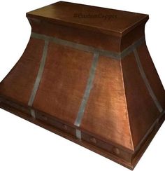 an old fashioned copper range hood is shown