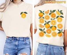 Get ready to zest up your summer wardrobe with this Cute Oranges T-shirt! 🍊🧡 Made for those who love all things fruity and fun, this Comfort Colors shirt is perfect for adding a pop of citrus to your outfit. The cottagecore vibes are strong with this vintage inspired oranges graphic T-shirt. The shirt features an adorable design on the back and a cute orange print in the front pocket area.🍊 Whether you're lounging in the sun at the park, vacationing somewhere in the tropics or strolling through the farmers market, this shirt will be a perfect choice! It will also make an awesome summer gift #OrangeYouGladYouFoundThisShirt COMFORT COLORS 1717 Comfort Colors 1717 Unisex shirt is a garment-dyed t-shirt. It's a fully customizable tee made 100% with ring-spun cotton. The soft-washed, garment Casual Orange Fruit Print Top, Fruit Shirt, Cottagecore Vibes, Summer Orange, Buy Clothes Online, Orange Print, Orange Fruit, Orange T Shirts, Comfort Colors Shirt