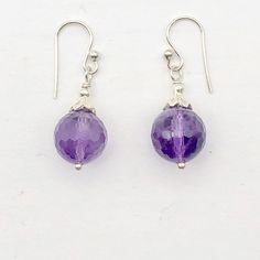 "SHIMMERING Natural Amethyst & Sterling Silver Earrings!! This is for one pair of natural royal purple Amethyst earrings. These amethyst earrings are absolutely the most incredible bright purple! Great earrings for a night out or a little shimmer for the office! These are natural amethyst earrings with Sterling Silver ear wires and findings. Quantity: 1 pair of earrings with silver ear wires Material Type: Amethyst/Silver Size: 10mm (Amethyst) / 1 1/4\" Long Color: Purple/Silver Legend: Amet Nickel-free Amethyst Lavender Earrings, Nickel-free Lavender Amethyst Earrings, Purple Gemstone Round Bead Earrings, Nickel-free Round Purple Earrings, Purple Gemstone Earrings With Round Beads, Lavender Amethyst Round Earrings, Purple Round Spiritual Earrings, Spiritual Round Purple Earrings, Spiritual Purple Round Earrings