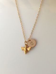 "This little honey bee necklace is a great piece to show those hard workers to stay strong and fierce, even through the toughest of times! A strong mother, excellent grandma, or brave little girl all show hard work, commitment, and dedication - just like this little bee! \"The bee is more honored than other animals, not because she labors, but because she labors for others!\" [ * ITEM INFO * ] ~ Materials making this piece are: 14k Gold Filled, Satin 24k Gold Plated Bee, - or - Sterling Silver ~ Hard Workers, Gold Bee, Bee Necklace, Bee Charms, Minimal Jewelry, Save The Bees, Necklace Box, Best Friend Gift, Necklace Personalized