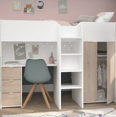 a child's bedroom with a loft bed and desk in the corner, next to a white rug