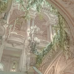 an ornate building with chandeliers and flowers on the ceiling