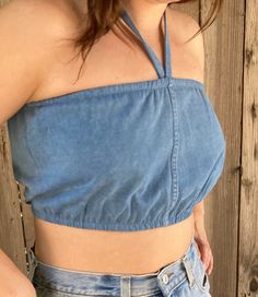 "These are handmade and reworked from old denim made into the perfect bubble tube tops that can be worn as halters or have the straps tucked in and worn as tubes. They best fit a small/ medium and fit from 24\"-30\" and are shown on a size medium model. The perfect summer wardrobe essential to pair with vintage Levis and prairie skirts. This listing is for one reworked bubble tube ✨(15)" Denim Blue Strapless Crop Top For Spring, Strapless Denim Blue Crop Top For Spring, Denim Blue Bandeau Tube Top, Denim Blue Bandeau Tube Top For Summer, Summer Denim Blue Bandeau Tube Top, Casual Denim Blue Bandeau Tube Top, Stretch Denim Blue Crop Top For Summer, Fitted Denim Bandeau Top, Summer Denim Blue Tube Top