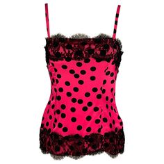 D&G by DOLCE & GABBANA casual top comes in a pink & black polka dot silk featuring a lace trim design, spaghetti straps, and a back zip up closure. Excellent Pre-Owned Condition. Marked: 38 Measurements: Bust: 29 inches Length: 14 inches Reference: 115646 Category: Casual Top More Details Brand: D&G by DOLCE & GABBANA Size: 2 Color: Fuchsia Color 2: Black Fabric: Silk / Elastane Material: Lace Trim Pattern: Polka Dot Style: Spaghetti Straps Age Group: Adult Gender: Female Dolce And Gabbana Corset, Dolce And Gabbana Pink Dress, Polka Dot Style, Vintage Dolce And Gabbana Top, Dolce And Gabbana Crop Top, Dolce And Gabbana Polka Dot Dress, Trim Design, Polka Dots Fashion, Atelier Versace