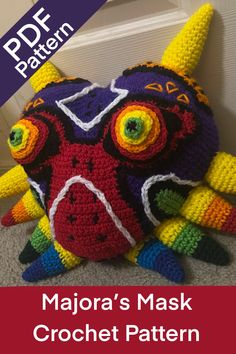 a crocheted stuffed animal with the words majora's mask on it