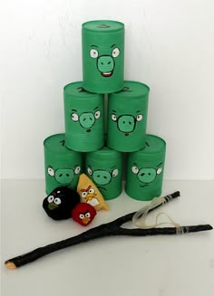 a stack of green toilet paper with angry birds on it next to some other items