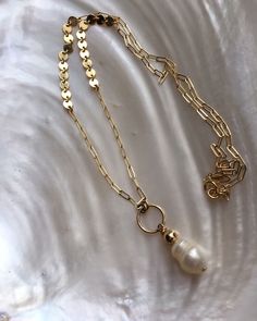 "A large baroque freshwater pearl pendant on a unique gold filled thick paperclip chain. A statement necklace that's elegant and edgy at the same time. All elements are very high quality 14kt gold filled and genuine pearl. Pearls will differ in shape and inclusions due to the raw nature of each, making each necklace unique to its owner. Measures 18\" with a 2\" extension. Pictures are with the longest length. ---------------------------------------------------------------------------- >> C Gold Necklace With Baroque Pearl And Paperclip Chain, Elegant Jewelry With Baroque Pearl And Paperclip Chain, Gold Pearl Necklace With Paperclip Chain, Minimalist Gold Pearl Necklace With Paperclip Chain, Baroque Pearl Paperclip Chain Jewelry Gift, Gold Pearl Necklace, Etsy Fashion, Gold Pearl, Unique Necklaces