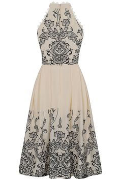 Step into spring with Zalie! Cut in a classic fit and flare silhouette, complete with a halter style neckline, this darling off-white midi dress is embroidered with contrasting black embroidery, realised in a lace motif. Blue Frock, Cape Dresses, Halter Neck Midi Dress, Frock And Frill, Embellished Midi Dress, Dresses Date Night, Embellished Maxi Dress, White Long Sleeve Dress, Black Embroidery