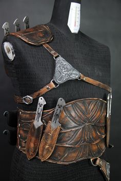 a woman's leather corset with metal accents