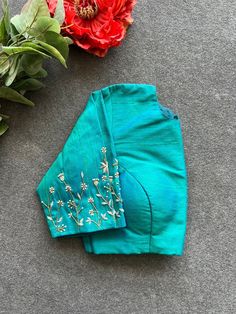 Hand embroidered ready made saree blouse / crop top/stitched saree blouse usa / sea green saree blouse/ hand embroidered blouse/zardosi blouse/sea green saree high neck blouse/green pure silk blouse/blue maggam work blouse        It is very true that a perfect blouse is the one which makes your saree look stand out !! If you find one of such a style that you have been wanting to have then dont let it go !! we carry such unique trending blouses that instantly add a stylish look to any saree !!     Well..!! we understand that you may not get in your desired size/pattern, here you go with customization according to your size/pattern which we can deliver in 1-2 weeks of time period !!      Here is a beautiful Hand embroidered saree blouse in mixed sea green color that has simple yet unique emb Affordable Green Festive Blouse Piece, Zardosi Blouse, Sarees For Girls, Perfect Blouse, Maggam Work Blouses, Hand Work Blouse, High Neck Blouse, Designer Sarees Online, Green Saree