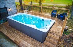 a hot tub sitting on top of a wooden deck