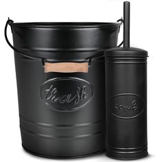 a black bucket with a wooden handle next to it and a canister on the side