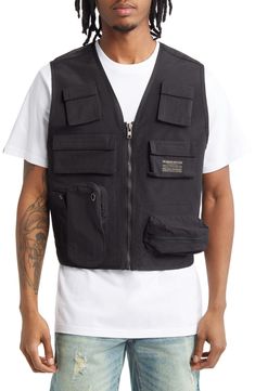 This front-zip utility vest is fitted with flap pockets and a breathable mesh back. 28" length (size Medium) V-neck 100% polyester Hand wash, line dry Imported Utility Vest, Billionaire Boy, Billionaire Boys Club, Black Fits, Black Media, Flap Pocket, Mens Coats, Vest Jacket, Nordstrom Rack