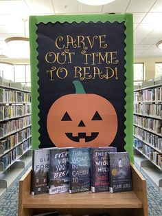 there is a sign that says drive out time to read with pumpkins on it