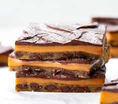 chocolate and peanut butter bars stacked on top of each other