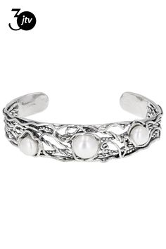 8-10mm white cultured freshwater pearl sterling silver adjustable cuff bracelet. Measures approximately 9/16" W and has no clasp closure. Colors, shapes, and sizes may vary. Elegant Adjustable Pearl Bracelet For Spring, Yellow Watches, School Jewelry, Jewelry Clasps, Popular Jewelry, Sterling Silver Cuff Bracelet, Pearl Types, Sterling Silver Cuff, Silver Cuff Bracelet