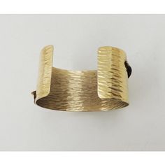 This is part of Chairish’s Costume Jewelry assortment.  Hammered goldtone cuff bracelet with "frosted" leaf on it. Marked "Napier." Dates to 1981. An identical bracelet is shown on pg. 547 of Melinda L. Lewis & Henry Swen's book "The Napier Co.: Defining 20th Century American Costume Jewelry." Opening in bracelet; 1 1/8 inches with a little bit of flexibility. Interior circumference; 6 3/4 inches. Overall measures: 2.5 inches wide by 1.88 inches deep by 1.88 inches high. Condition: Very good; Mi American Costume, Book Pieces, Modern Branding, Cuff Bracelet, Costume Jewelry, 20th Century, Dates, Gold Tones, Cuff