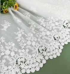 Description: Wide lace trim, Embroidery floral cotton trim in off white, Cotton Lace Trim Embroidered, ideal for sew on garments ◆This listing is for 1 Yard. More in stock, will be sent in one continuous piece whenever possible. ◆Width: the full width is about 14.56'' ( 37 cm) ◆It will be perfect for bow knots hairpin, baby clothes, sleeve edge, skirt edge,curtain, veil, socks, dress, home decoration, handbags, tablecloth... ◆Wholesale acceptable! ◆If you want more, please feel free to send me a Embroidered White Lace For Spring, Spring Embroidered White Lace, White Lace Fabric With Floral Applique, Spring White Embroidered Lace, White Cotton Lace With Lace Patchwork, White Embroidered Lace Fabric For Summer, Summer White Embroidered Lace Fabric, White Cotton Lace With Patchwork, Spring White Embroidered Fabric With Lace Work