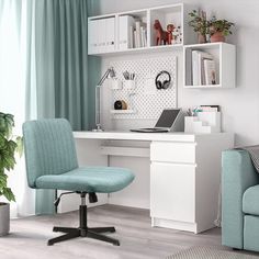 a blue chair sits in front of a white desk