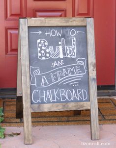 a chalkboard sign sitting in front of a red door