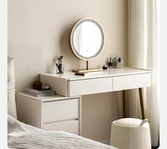 a white desk with a mirror on top of it