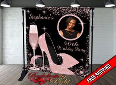 a black and pink birthday party backdrop with high heels