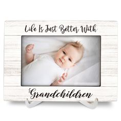 a wooden frame with the words, life is just better with an image of a baby