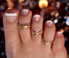 SIZING METHOD for Toe or Midi Rings: 1) For Toe Rings, use half of your shoe size, or your full pinkie size (80% accurate) 2) Measure your Toe/Finger using a string or Dental Floss * With a piece of string or dental floss, wrap it snugly but not tight at the part of the toe/midi where you want the ring will lay (on the toes, typically between the knuckles) and mark it where the ends meet. * Lay your measured string on the mm side of a ruler and get a mm measurement. * Look up your size on the ch White Stackable Toe Rings, White Stackable Toe Ring Jewelry, Nickel-free White Toe Ring, Nickel-free White Toe Ring Jewelry, Nickel Free White Toe Ring, Adjustable White Toe Rings, White Open Ring Toe Rings As Gift, Handmade White Midi Rings For Wedding, Adjustable White Toe Rings For Gift