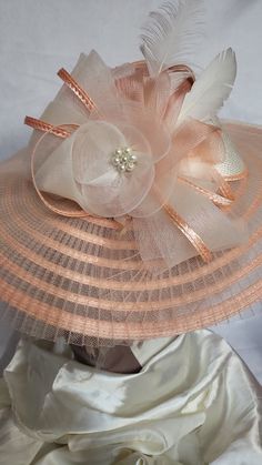 Big brim Peach and cream beautiful elegant good for all occasions. Derby ready Elegant Beige Fedora Sun Hat, Elegant Beige Sun Hat With Short Brim, Elegant Beige Flat Brim Sun Hat, Chic Beige Mini Hat For Church, Beige Straw Hat For Evening In Spring, Evening Beige Straw Hat For Spring, Elegant Cream Brimmed Sun Hat, Elegant Beige Brimmed Hat, Elegant Pink Beach Hat