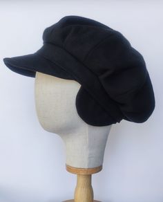 Introducing our Black Baker Boy Hat -- a fusion of style and functionality. Crafted from high-quality wool, this cap is not just an accessory, it's a statement of enduring sophistication. 🖤 Sleek in Black: The classic black hue adds an element of timeless style, making this newsboy cap a versatile companion for any winter ensemble. ❄️ Winter-Ready Comfort: Constructed from warm wool, this cap is not only a fashion statement but also a reliable shield against winter's chill. Perfect for winter s Black Wool Beret Cap, Adjustable Winter Felt Hat Flat Cap, Adjustable Winter Felt Flat Cap, Adjustable Felt Flat Cap For Winter, Adjustable Wool Beret For Fall, Black Wool Beret, Winter Wool Baseball Cap With Short Brim, Wool Visor Hat For Winter, Winter Wool Visor Hat