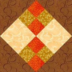 an orange, yellow and brown patchwork quilt