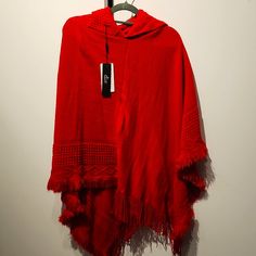 Red, Asymmetric, Detailed, Hooded Pancho. One Size Red Long Sleeve Poncho, One Size, Red One-size Poncho Cape, Red One-size Cape Poncho, Red One Size Cape Poncho, Oversized Red Poncho Cape, Red Oversized Poncho, Red Oversized Poncho For Winter, Oversized Red Poncho For Winter, Casual Red Long Sleeve Poncho